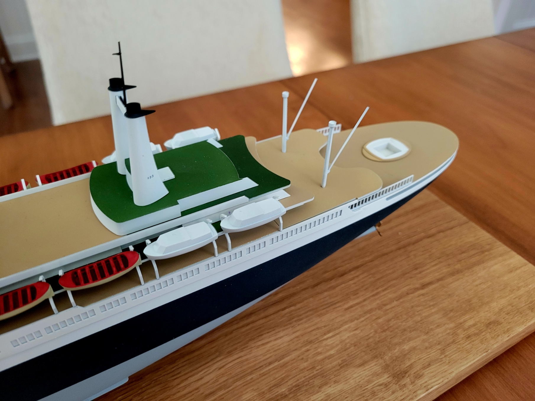Aft view of the SS Rotterdam V scale model, featuring twin funnels, tenders, and the stern swimming pool