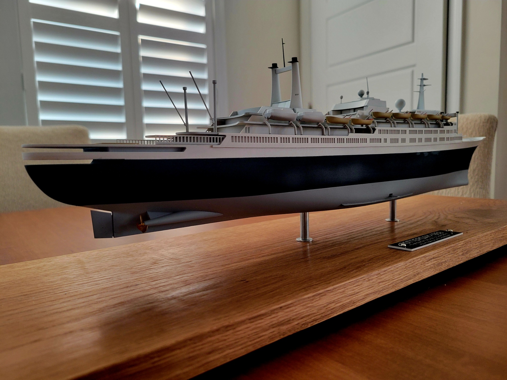 Aft starboard view of the SS Rotterdam V scale model with a custom blue hull and reconfigured deck details